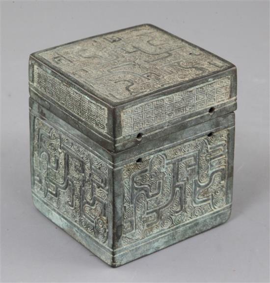 A Chinese archaic bronze square box and cover, Eastern Zhou dynasty, 6th-5th century B.C., 9.3cm high